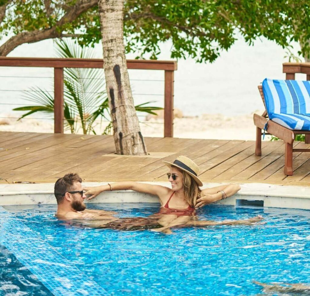 How much does it cost to stay at a private island in Belize?