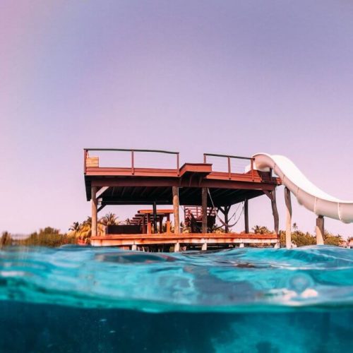 a slide straight into ocean at ray caye resort